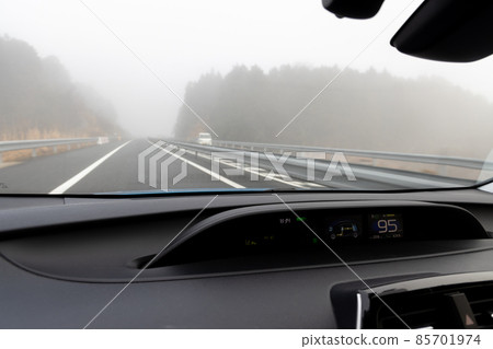 Scenery from the passenger seat of a car traveling on the Kyoto Jukan Expressway with thick fog and poor visibility Scenery from the passenger seat of a car traveling on the Kyoto Jukan Expressway with thick fog and poor visibility 85701974