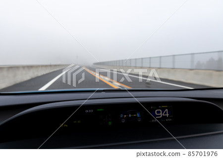 Scenery from the passenger seat of a car traveling on the Kyoto Jukan Expressway with thick fog and poor visibility Scenery from the passenger seat of a car traveling on the Kyoto Jukan Expressway with thick fog and poor visibility 85701976