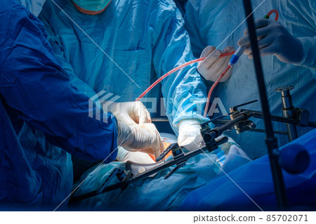 Hands of doctors in sterile gloves Hands of doctors in sterile gloves 85702071