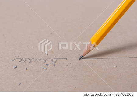 Close up a sharpened pencil writing a straight line Close up a sharpened pencil writing a straight line 85702202
