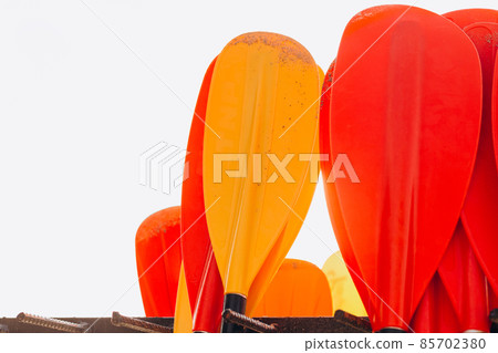 Set of colorfur paddles of kayak and canoe sport, many plastic paddles. Rent of equipment for swimming in the ocean or sea, summer time 85702380