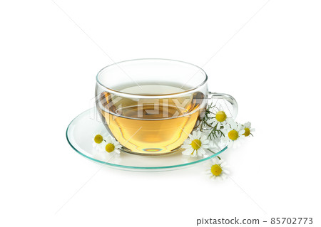 Cup of chamomile tea isolated on white background Cup of chamomile tea isolated on white background 85702773