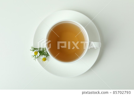 Cup of chamomile tea on white background 85702793