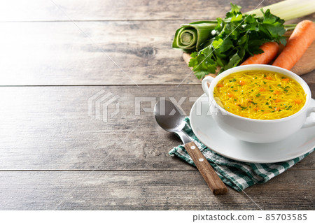 Chicken noodle soup in white bowl Chicken noodle soup in white bowl 85703585