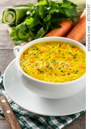 Chicken noodle soup in white bowl Chicken noodle soup in white bowl 85703587