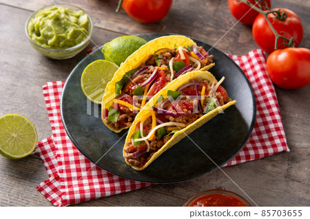 Traditional Mexican tacos with meat and vegetables 85703655