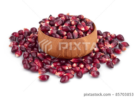 Purple corn seeds in wooden bowl isolated on white background with clipping path and full depth of field Purple corn seeds in wooden bowl isolated on white background with clipping path and full depth of field 85703853