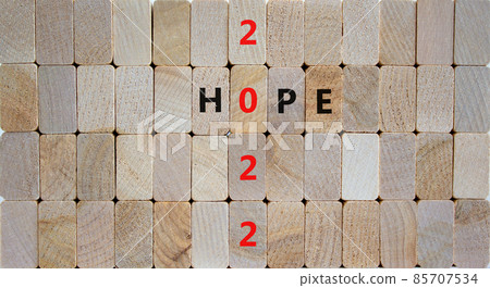 2022 hope new year symbol. Wooden blocks with words 'Hope 2022'. Beautiful wooden background, copy space. Business, 2022 hope new year concept. 85707534