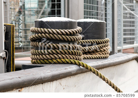 Ships rope or rope tied to a mooring bollard. Ships rope or rope tied to a mooring bollard. 85708599