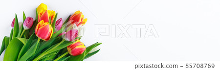 Colorful bouquet of fresh spring tulips on white background. Happy Easter, holiday symbol. Place for text. 85708769