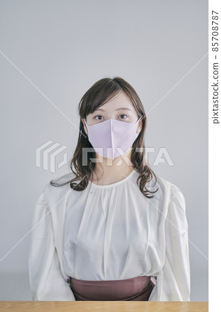 Young lady in mask shape Young lady in mask shape 85708787