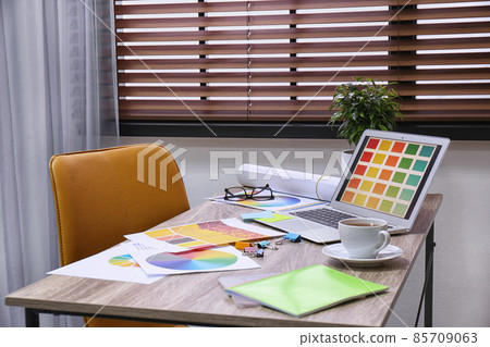 Modern designer's workplace with stylish new laptop 85709063
