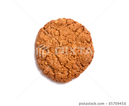 Oat vanilla sugar cookie isolated on white background. Close-up view of brown yellow snacks. Macro shot of beige biscuit cake for your design Oat vanilla sugar cookie isolated on white background. Close-up view of brown yellow snacks. Macro shot of beige biscuit cake for your design 85709458