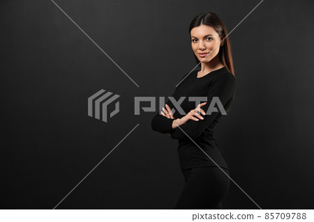 Woman wearing thermal underwear on black background. Space for text 85709788
