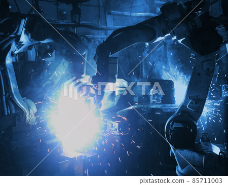welding robot in the automotive parts industry, The movement of the robot welding in  auto parts factory. 85711003