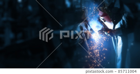 welder Industrial automotive part in factory, worker with protective mask welding metal (welding, welder, steel) 85711004