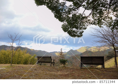 Bench to see the autumn mountains Bench to see the autumn mountains 85711344