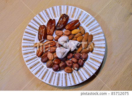 Almonds, hazelnuts, walnuts and other. Healthy food snack mix on white table, top view, copy space 85712075