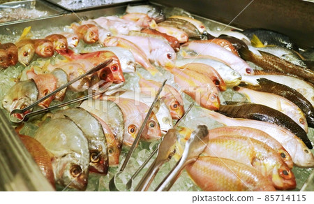 Ice cubes filled with freshly caught fish 85714115