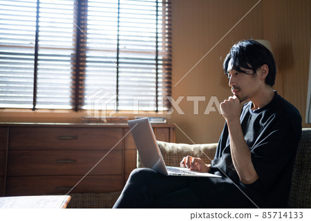 Middle male computer living room 85714133