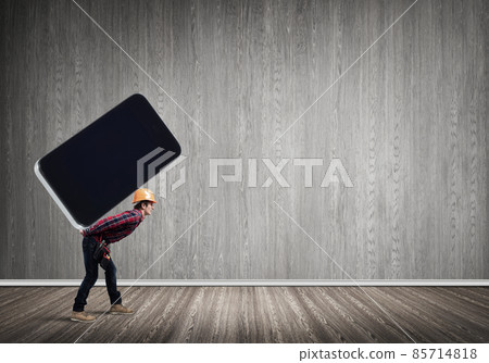 Builder man carry huge smartphone Builder man carry huge smartphone 85714818