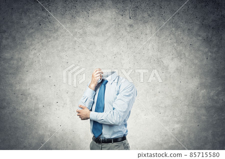Headless pensive businessman Headless pensive businessman 85715580