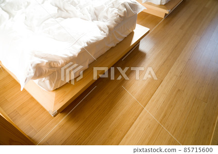 Unmade bed with white blanket in japanese room style Unmade bed with white blanket in japanese room style 85715600