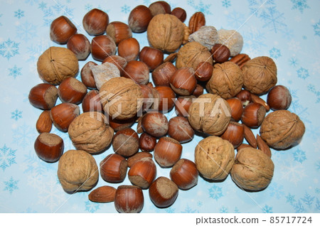 Background with different kinds of nuts.Walnuts,hazelnuts...... 85717724