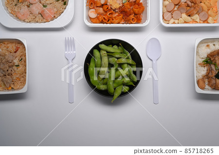 Frozen edamame soybeans in round bowl on white background. Frozen edamame soybeans in round bowl on white background. 85718265