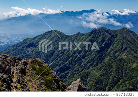 Mt. Gongen and the mountains of the Southern Alps seen from the Yatsugatake mountain range and Mt. Aka Mt. Gongen and the mountains of the Southern Alps seen from the Yatsugatake mountain range and Mt. Aka 85718325