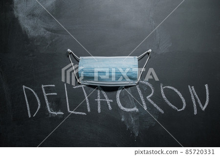 Medical Mask and Deltacron written in chalk on the board. Deltacron new version of Covid 19 in 2022 85720331
