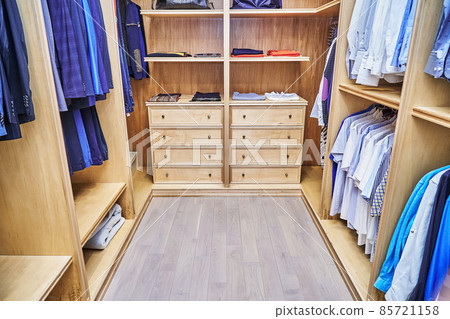 Stylish walk in closet with furniture made of maple wood 85721158