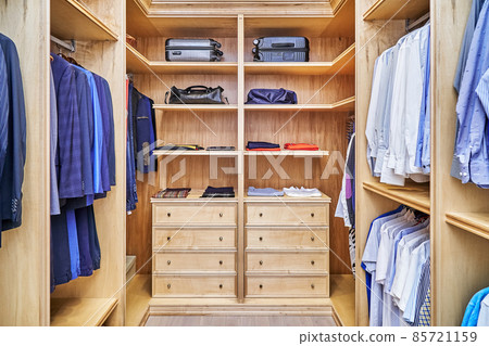 Stylish walk in closet with furniture made of maple wood Stylish walk in closet with furniture made of maple wood 85721159