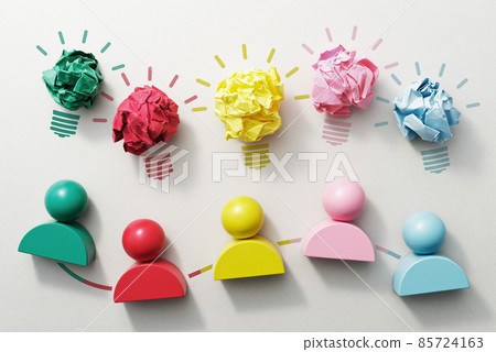 Teamwork and creativity. A bird's-eye view of a cube with blocks and icons in the shape of people of various colors. 85724163