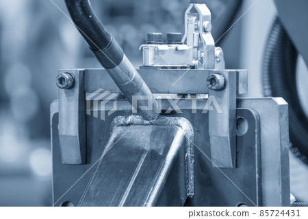 Close-up scene of the welding robot operation with electric welding process. Close-up scene of the welding robot operation with electric welding process. 85724431