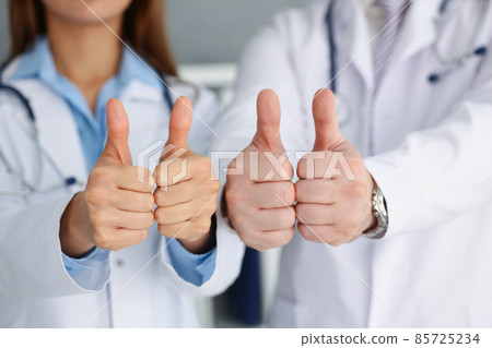 Doctors hands show ok or confirm sign with thumb up Doctors hands show ok or confirm sign with thumb up 85725234