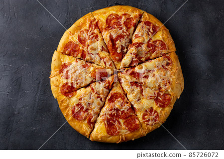 Tasty hot homemade pepperoni pizza. Traditional classic pizza with salami and cheese. Top view 85726072