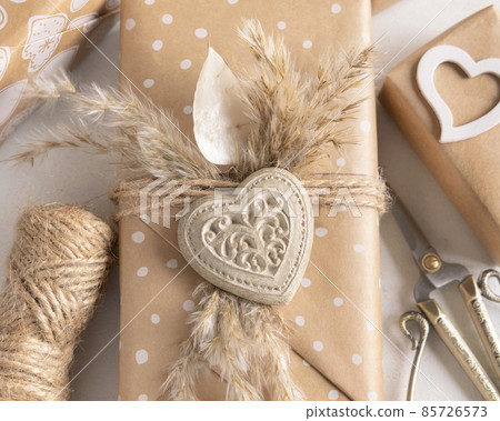 Valentines present decorated with heart and pampass grass top view Valentines present decorated with heart and pampass grass top view 85726573