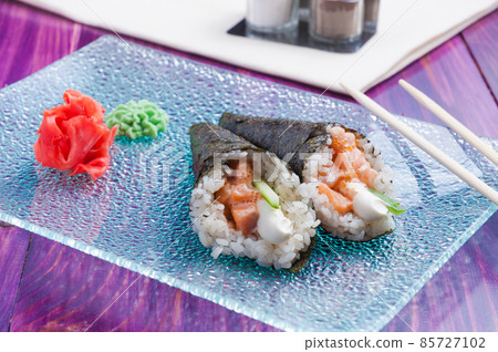 temaki with salmon cucumber and cream cheese. Japanese cuisine 85727102