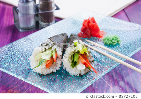 vegetarian temaki with cream cheese, sweet pepper and lettuce. Japanese cuisine 85727103