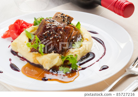 Lamb shank with mashed potato and asparagus. Lamb shank with mashed potato and asparagus. 85727216