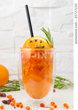 sea buckthorn refreshing drink on a light background sea buckthorn refreshing drink on a light background 85727220