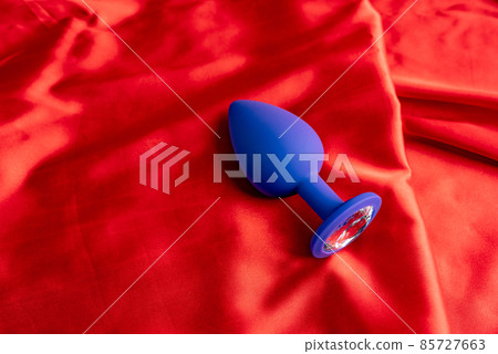 a collection of different types of sextoys on red satin a collection of different types of sextoys on red satin 85727663
