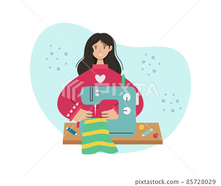 The girl sews on a sewing machine. Creative profession. The girl sews on a sewing machine. Creative profession. 85728029