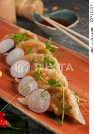 gyoza fried dumplings with pork and vegetables. Traditional Asian cuisine. Selected focus 85728197