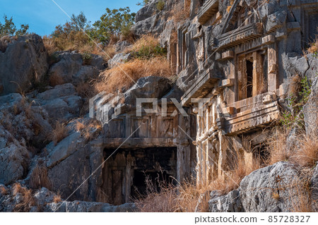ancient tombs and crypts carved into the rocks in the ruins of Myra 85728327