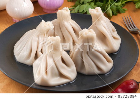 tasty khinkali with lamb. Traditional Georgian cuisine 85728884