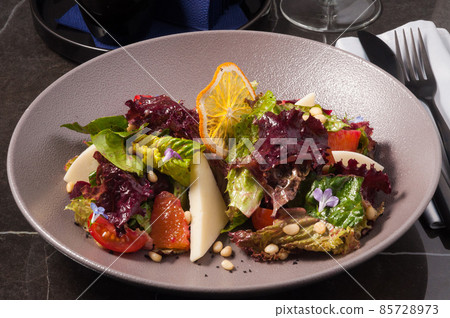 salad with goat cheese and vegetables. Vegetarian food salad with goat cheese and vegetables. Vegetarian food 85728973