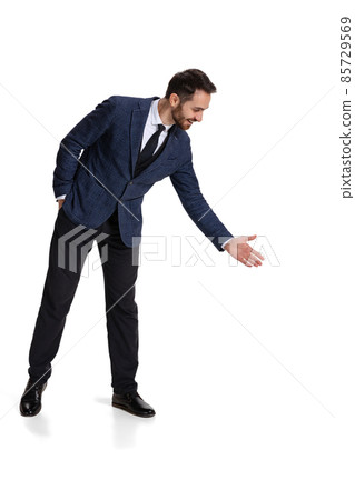 Full-length portrait of businessman laughing and pointing at some information isolated over white background 85729569