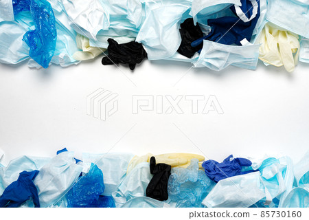 Waste of used personal protective equipment PPE, gloves, disposable masks, shoe covers of medical workers. Garbage contamination after the COVID-19 pandemic Waste of used personal protective equipment PPE, gloves, disposable masks, shoe covers of medical workers. Garbage contamination after the COVID-19 pandemic 85730160